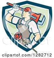 Clipart Of A Retro Cartoon Male Plumber With A Giant Monkey Wrench And A Plunger In A Blue White And Green Shield Royalty Free Vector Illustration