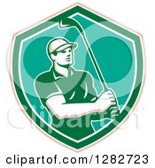 Clipart Of A Retro Male Golfer Holding A Club In A Tan White Turquoise And Green Shield Royalty Free Vector Illustration