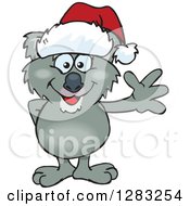 Clipart Of A Friendly Waving Koala Wearing A Christmas Santa Hat Royalty Free Vector Illustration
