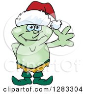 Clipart Of A Friendly Waving Goblin Wearing A Christmas Santa Hat Royalty Free Vector Illustration