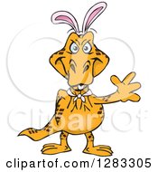 Clipart Of A Friendly Waving Goanna Lizard Wearing Easter Bunny Ears Royalty Free Vector Illustration