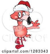 Friendly Waving Pink Flamingo Wearing A Christmas Santa Hat