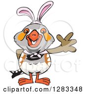 Clipart Of A Friendly Waving Zebra Finch Wearing Easter Bunny Ears Royalty Free Vector Illustration