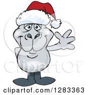 Clipart Of A Friendly Waving Dugong Wearing A Christmas Santa Hat Royalty Free Vector Illustration