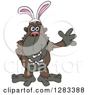 Clipart Of A Friendly Waving Dark Brown Ape Wearing Easter Bunny Ears Royalty Free Vector Illustration by Dennis Holmes Designs