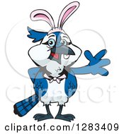 Clipart Of A Friendly Waving Blue Jay Bird Wearing Easter Bunny Ears Royalty Free Vector Illustration