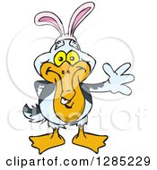 Clipart Of A Friendly Waving Pelican Wearing Easter Bunny Ears Royalty Free Vector Illustration