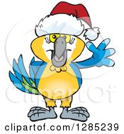 Clipart Of A Friendly Waving Blue And Yellow Macaw Wearing A Christmas Santa Hat Royalty Free Vector Illustration