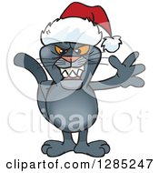 Clipart Of A Friendly Waving Black Panther Wearing A Christmas Santa Hat Royalty Free Vector Illustration