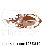 Clipart Of A Brown American Football With A Trail Of Flames Royalty Free Vector Illustration