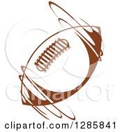 Clipart Of A Brown American Football Spinning Royalty Free Vector Illustration by Vector Tradition SM