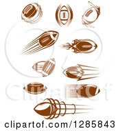 Clipart Of Brown American Football Some With Trails Of Flames And Speed Royalty Free Vector Illustration