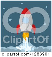 Clipart Of A Modern Flat Design Of Ared And Metal Rocket Breaking Through Clouds In A Starry Sky Royalty Free Vector Illustration