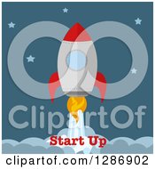 Clipart Of A Modern Flat Design Of A Red And Metal Rocket Breaking Through Clouds With Start Up Text Royalty Free Vector Illustration
