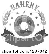 Clipart Of A Grayscale Bakery Donut Design With Wheat And A Blank Banner Royalty Free Vector Illustration