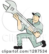 Clipart Of A Retro Cartoon Male Mechanic Kneeling And Holding An Adjustable Wrench Royalty Free Vector Illustration
