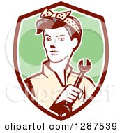 Clipart Of A Retro Female Mechanic Holding A Wrench In A Maroon White And Green Shield Royalty Free Vector Illustration