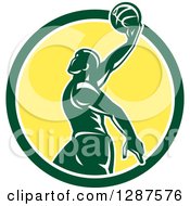 Poster, Art Print Of Retro Silhouetted Green Basketball Player Doing A Layup In A Green White And Yellow Circle