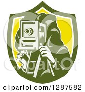 Poster, Art Print Of Retro Male Photographer Using A Box Camera In A Green White And Yellow Shield