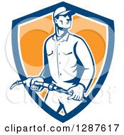 Clipart Of A Retro Gas Station Attendant Jockey Holding A Nozzle In A Blue White And Orange Shield Royalty Free Vector Illustration by patrimonio