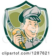 Poster, Art Print Of Retro Cartoon Winking Gas Station Attendant Jockey Holding A Nozzle In A Green And White Shield