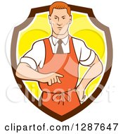 Poster, Art Print Of Retro Cartoon Red Haired White Male Chef Wearing An Apron And Pointing In A Brown White And Yellow Shield