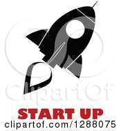 Clipart Of A Modern Flat Design Of A Black And White Rocket With A Red Trail And Start Up Text Royalty Free Vector Illustration