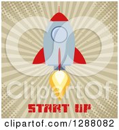 Clipart Of A Modern Flat Design Of A Red And Metal Rocket Taking Off Over Start Up Text Grungy Halftone And Rays Royalty Free Vector Illustration