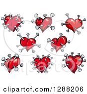 Clipart Of Red Hearts Poked With Nails Royalty Free Vector Illustration