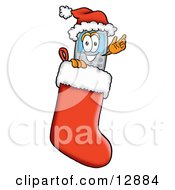 Clipart Picture Of A Wireless Cellular Telephone Mascot Cartoon Character Wearing A Santa Hat Inside A Red Christmas Stocking by Toons4Biz