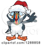 Poster, Art Print Of Cartoon Happy Puffin Bird Wearing A Christmas Sant Hat And Waving
