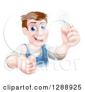 Poster, Art Print Of Happy Brunette Middle Aged White Male Electrician Giving A Thumb Up And Holding A Light Bulb Over A Sign