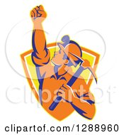 Poster, Art Print Of Retro Male Coal Miner Holding Up A Fist And A Pickaxe In A Yellow And Orange Shield