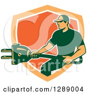 Poster, Art Print Of Retro Male Electrician Holding A Giant Plug In An Orange And White Shield