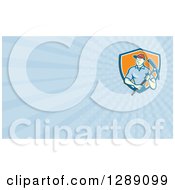 Clipart Of A Retro Cartoon Male Construction Worker Holding A Pickaxe And Blue Rays Background Or Business Card Design Royalty Free Illustration