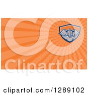 Clipart Of A Retro Angry Elephant And Orange Rays Background Or Business Card Design Royalty Free Illustration
