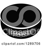 Clipart Of A Black And White Hockey Puck 2 Royalty Free Vector Illustration