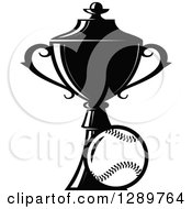 Clipart Of A Black And White Softball Or Baseball By A Sports Championship Trophy 2 Royalty Free Vector Illustration