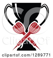 Clipart Of A Black And White Sports Trophy And Crossed Red Throwing Darts Royalty Free Vector Illustration