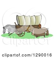Oregon Trail Covered Wagon With Horses Grazing Around It