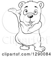 Clipart Of A Black And White Cute Presenting Bear Royalty Free Vector Illustration