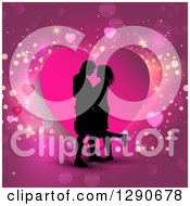 Poster, Art Print Of Black Silhouetted Couple Kissing Over A Pink Heart And Sparkly Background