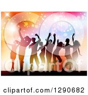 Poster, Art Print Of Group Of Young Silhouetted Dancers Against Colorful Flares Sparkles And Lights