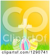 Clipart Of A Cross Over 3d Easter Eggs Grass And Colorful Gradient Royalty Free Vector Illustration by elaineitalia
