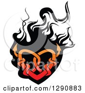 Clipart Of A Gradient Red Tribal Heart Over Black Flames 3 Royalty Free Vector Illustration