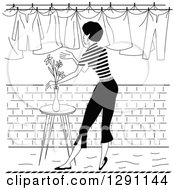 Poster, Art Print Of Black And White Rear View Of A Retro Woman Hanging Laundry Out To Dry