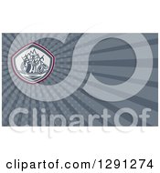 Clipart Of A Retro Fireman And Gray Rays Background Or Business Card Design Royalty Free Illustration