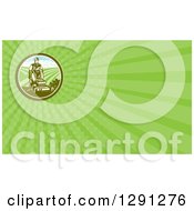 Clipart Of A Retro Woodcut Landscaper Mowing A Lawn With Farmland And Green Rays Background Or Business Card Design Royalty Free Illustration