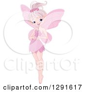Clipart Of A Cute Glittery Pink Fairy Pixie Holding A Tiny Valentine Heart Royalty Free Vector Illustration