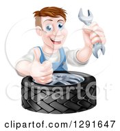 Poster, Art Print Of Happy Middle Aged Brunette White Mechanic Man Holding A Wrench And Thumb Up Over A Tire